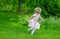 Child running through a garden