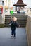 Child running with toy windmill