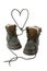 Child\'s boots form a heart with shoelaces.
