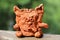 Child\'s ceramic handicraft. Funny cat statuette.
