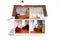 Child\'s doll house with furniture on white