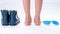 Child`s feet, orthopedic shoes and insoles isolated on a white background