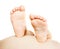 Child\'s feet on pregnant tummy