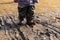 Child`s feet in rubber boots stained in spring mud