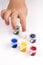 Child\'s finger is showing white colour of school tempera paints