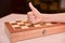 Child`s hand on the chessboard showing thumb up. cool game at home