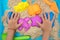 Child`s hand close up playing kinetic sand