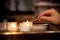 Child\'s hand lighting a candle in church