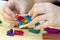 The child`s hand molded figurines from colored clay