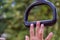 Child`s hand  nearly achieving goal of grabbing a monkey bar at a playground conecept trying and striving to holding on for