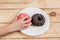 Child`s hand reaches donuts. Tasty food for kids. having fun with doughnut