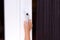 Child\'s hand on secure window handle