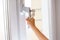 Child\'s hand on secure window handle