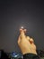 A child& x27;s hand is in the shape of a heart, loves the moon at night, Tangerang Indonesia