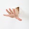 Child\'s hand stick out from hole