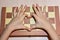 The child`s hands on the chessboard show the heart and love of playing chess