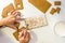 Child`s hands decorating gingerbread cookies, sensory game concept for kids