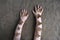 Child`s hands with dried hydrangea flowers on burlap background. Feeling nature, sustainable living, natural care, organic