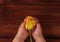 Child`s hands hold yellow tulip flower flat lay. Love, people care kids donations charity, grace support welfare concept