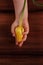 Child& x27;s hands hold yellow tulip flower flat lay. Love, people care kids donations charity, grace support welfare concept