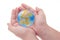 Child\'s hands holding jigsaw puzzle globe