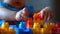 Child\\\'s hands joyfully explore colorful building blocks in a close-up view, Ai Generated