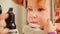 Child`s optometry concept - little girl checks eyesight in eye ophthalmological clinic