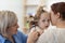 Child`s otolaryngologist doing ear examination of little kid