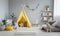 A child\\\'s playroom with a teepee tent