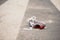 Child`s shoe on the street after dangerous traffic incident