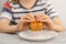 Child& x27;s treat moment: A young boy savoring the aroma, poised to enjoy his baked puff pastry