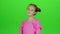 Child is sad, she was riddled with unpleasant news. Green screen. Slow motion