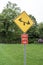 Child safety zone sign, yellow black, red white, icon see-saw