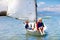 Child sailing. Kid learning to sail on sea yacht