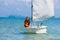 Child sailing. Kid learning to sail on sea yacht