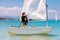 Child sailing. Kid learning to sail on sea yacht