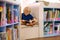 Child in school library. Kids reading books