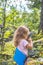 Child, scout in the forest with walkie-talkie