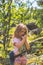 Child, scout in the forest with walkie-talkie