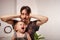 The child is screaming, hysterical. A tired dad doesn`t want to hear the baby. The parent is irritated, tired, wants to take a