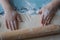 Child sculpts cookies from the dough, hands closeup