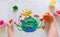 Child sculpturing plasticine planet for earth day. Protection of environment, Save our planet. Ecology concept.