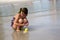 Child searching for shells at the beach.