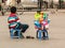 child selling toys at Hanoi central square, Vietnam