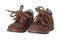 Child shoe fashion. A pair of elegant brown leather shoes with s