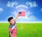 Child show flag america on blue sky cloud and sun with green me