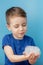 Child showing his hands with soap lather, cleaning and hygiene concept.Cleaning your hands frequently with water and soap will