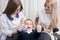 Child showing thumbs up gestures of good class when dentists examining and working on boy patient