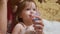 Child is sick and breathes through an inhaler. Toddler treats flu by inhaling inhalation vapor. little girl treated with