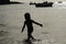 Child silhouette at sea